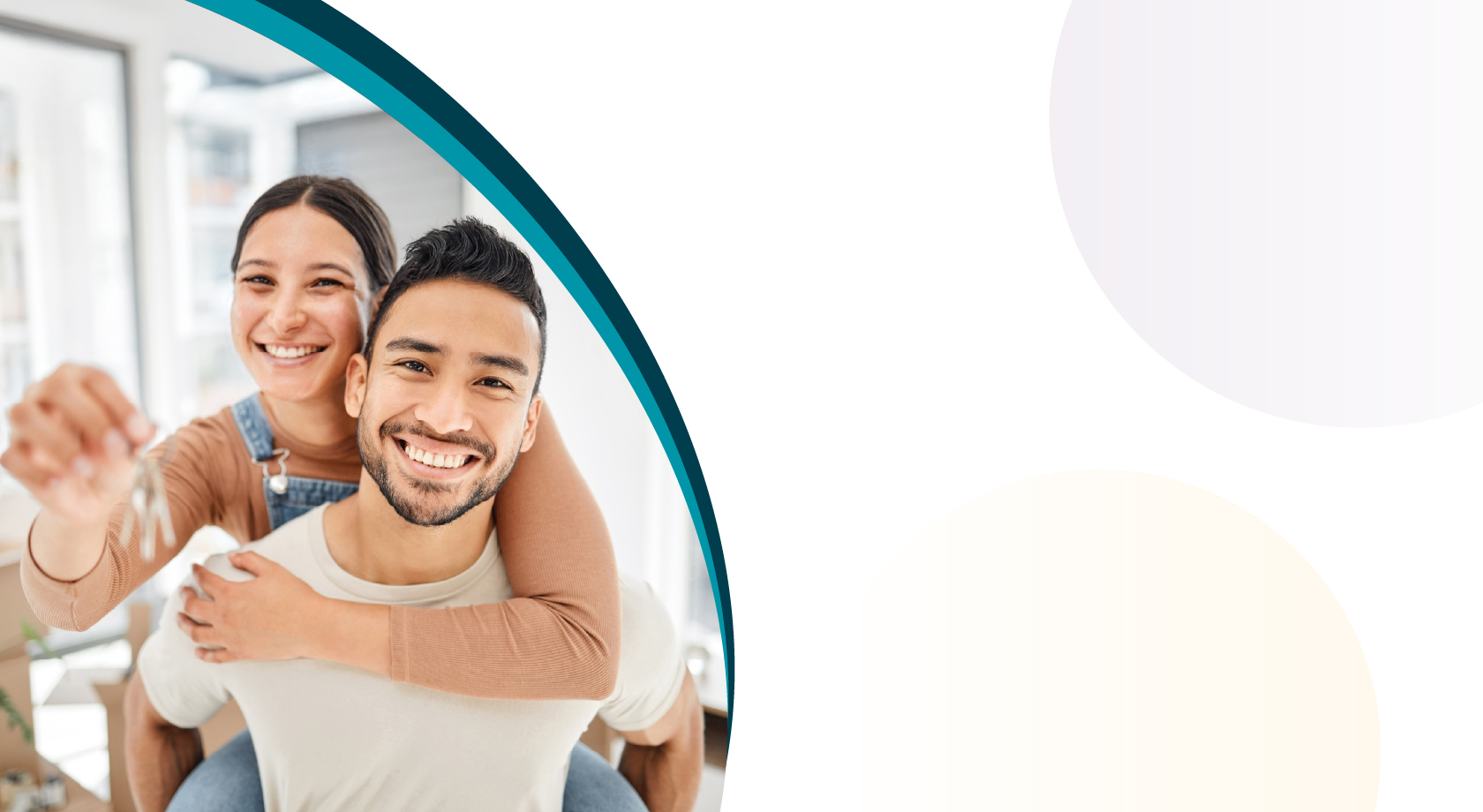 Young couple smiling and holding keys. 